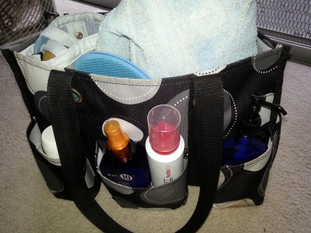 My Thirty-One Gifts utility tote has a place for everything. I put my shower bag, towel, robe, and flipflops in the bag itself and other toiletries in the outside pockets.