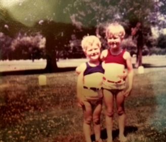 We were the "little girls" of the family, and my mother dressed us alike. I usually had blue; Trish wore red. I'm sporting a diaper under that swimsuit.