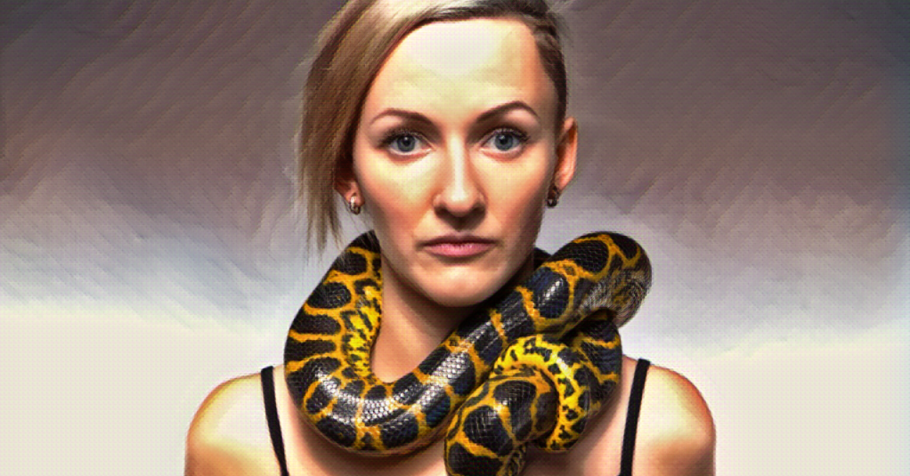 Photo illustration: woman with a king snake wrapped around her neck.